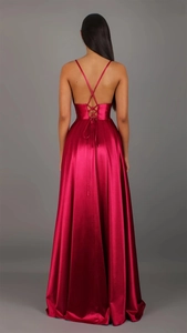 Detail view of burgundy satin dress showing backless cross straps and tie-waist design