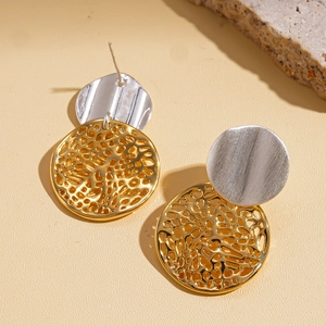 Detailed close-up of 18k gold plated geometric earrings with mixed metal textures