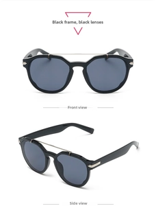 Detail view of large frame sunglasses with black frame and silver metal bridge