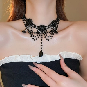 Gothic layered black crystal floral necklace with teardrop fringe on model