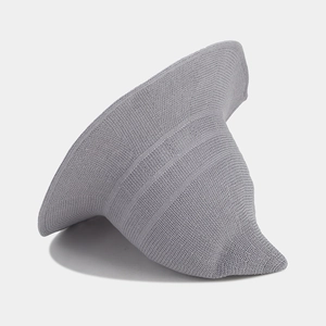 Detailed view of light gray knitted witch sun hat with ribbed texture and wavy brim