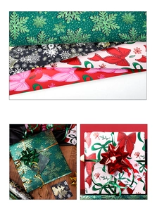 Detail of Christmas wrapping paper rolls with pink bows and green snowflake patterns