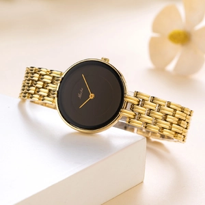 Elegant gold metal link watch with a minimalist black dial and golden hands for women