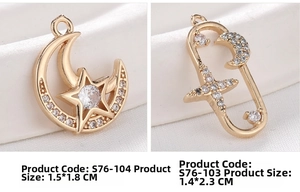 Macro shot of 18K gold plated star and moon pendants with micro-pave cubic zirconia