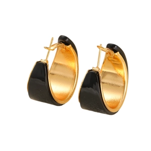Elegant wide C-shape hoop earrings with black enamel and gold plating on white background