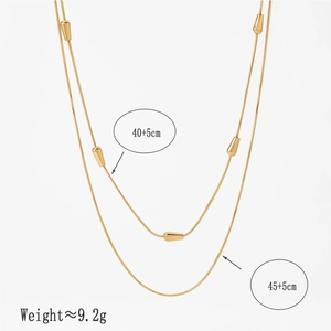 Double-layered golden stainless steel necklace with oval beads and polished finish