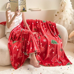 Thick red Christmas flannel blanket with festive prints for cozy winter holiday decor