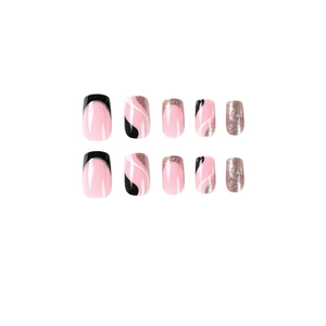 Pink press-on nails with black waves, silver glitter, and white swirl patterns