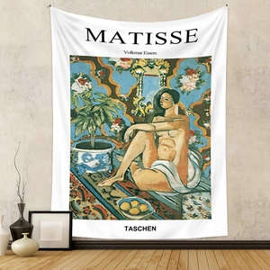 Detailed view of bohemian Matisse style wall tapestry on a textured grey background