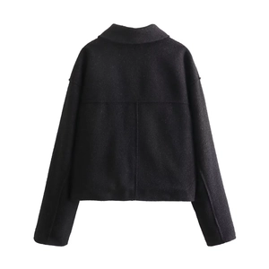 Back view of a cropped black wool coat with lapel collar and long sleeves detail