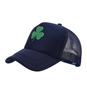 Navy blue trucker hat with green shamrock embroidery and breathable mesh back