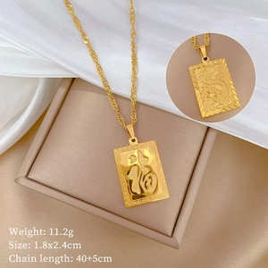 Detail of gold titanium steel dragon pendant necklace with Fu character and fine texture