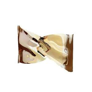 Modern irregular crumpled gold metal cuff bracelet with a polished wavy finish