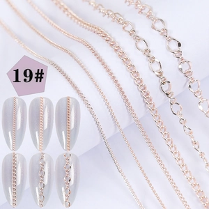 Detail of rose gold nail art chains featuring various textures and application on nails