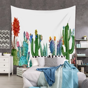 Detail of bohemian tapestry featuring watercolor cactus and succulent patterns on white fabric