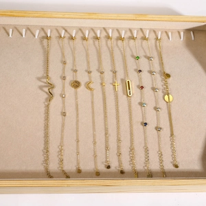 Set of 10 gold-plated stainless steel bracelets with geometric zircons and charms