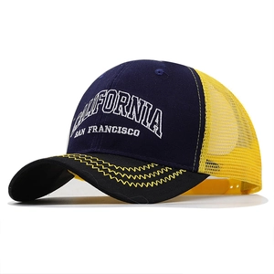 Navy blue California mesh trucker hat with yellow breathable back and white embroidery