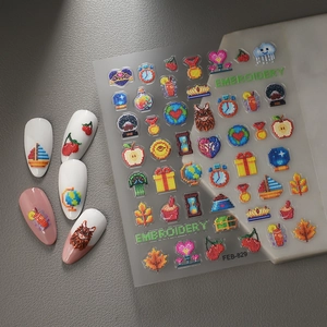 3D embossed nail art stickers with colorful embroidery style cartoon icons on dark leather