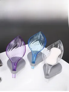 Leaf-shaped soap holder showing angled drainage structure in purple, blue, and clear colors