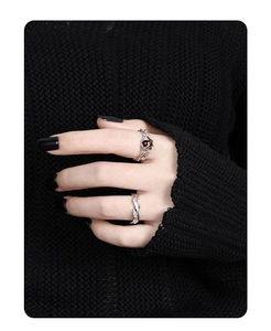 Detailed view of irregular hollow S925 silver rings with tiger eye stone on hand