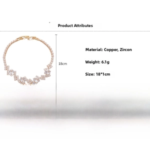 Macro view of gold tennis bracelet with oval cubic zirconia settings and technical specs