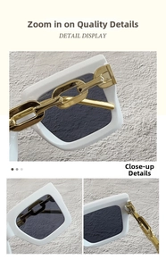 Primer plano de gafas de sol blancas cuadradas con detalle de cadena dorada gruesa