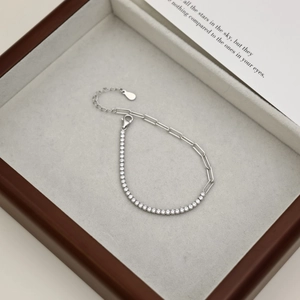 Detailed macro view of S925 sterling silver pink heart tennis bracelet in wooden gift box