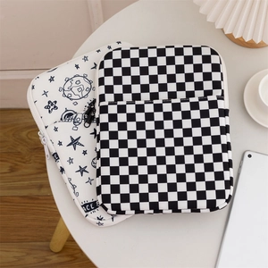 Detailed view of checkerboard and space themed shockproof padded laptop sleeves