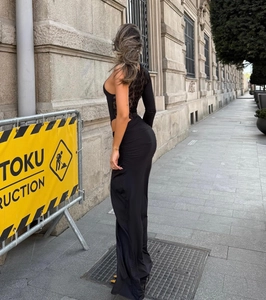 Detailed back view of a one-shoulder black dress with intricate lace cutout splicing