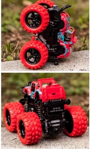 Close-up of a red and blue monster truck toy with large wheels and speed decals