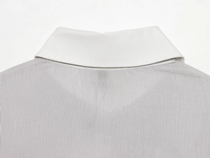 Close-up of white collar and grey fine stripe pattern on long sleeve shirt fabric