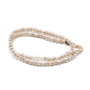 Elegant double-layered natural freshwater pearl necklace with adjustable gold clasp closure