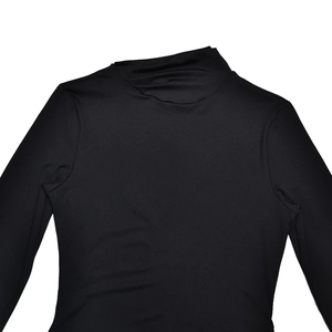 Detailed view of the smooth black fabric and snug neckline of this slim-fit long-sleeve dress