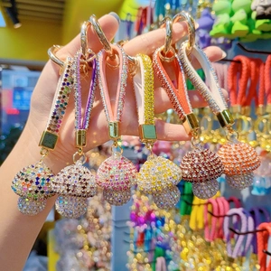 Sparkling crystal mushroom keychains with rhinestone straps in vibrant assorted colors