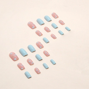 Pink and blue heart pattern square press-on nails set with 24 pieces on beige background