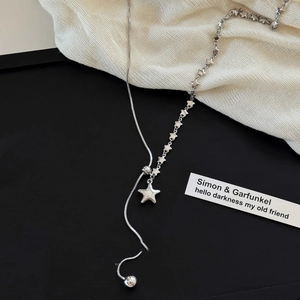 Asymmetric silver star necklace with snake chain and adjustable star pendant
