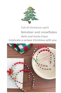 Detail of beaded Christmas headbands with Santa, reindeer and bell festive elements