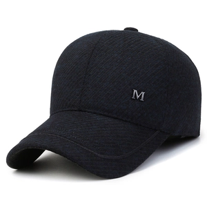 Winter men's baseball cap with ear protection in dark navy twill and metal M logo