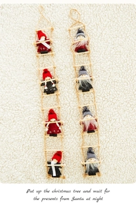 Detail of wooden ladder Christmas ornaments with knitted plush figures on faux fur background