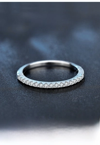 Macro detail of S925 sterling silver row ring with sparkling moissanite stones