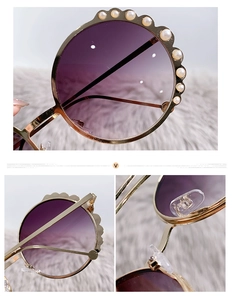 Detail of round gold metal sunglasses featuring pearl embellishments and purple gradient lenses