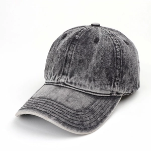 Close-up of washed denim baseball cap detailing vintage gray fabric and stitching