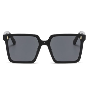 Fashionable oversized square black sunglasses with gold metal studs and grey lenses