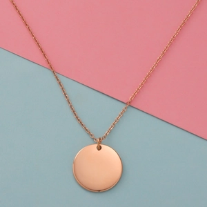 Polished rose gold round pendant necklace with minimalist design and sleek metal finish