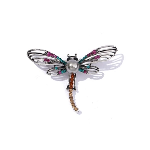 Elegant dragonfly brooch with colorful crystals and grey pearl on vintage silver base