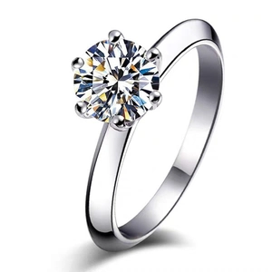 Macro side view of silver six-prong setting classic round brilliant zircon wedding ring