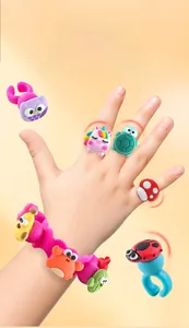Detail of colorful cartoon animal silicone rings and pink bracelet for children