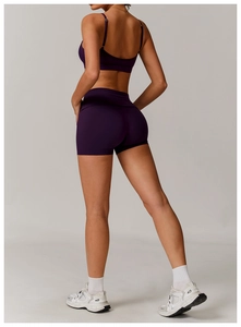 Detail of dark purple recycled yoga set featuring a strapless tank top and high-waist shorts