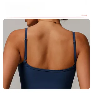 Detail of navy yoga tank top featuring adjustable thin straps and hollow square back design