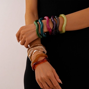 Irregular wavy acrylic bangle bracelets in colorful translucent and solid finishes